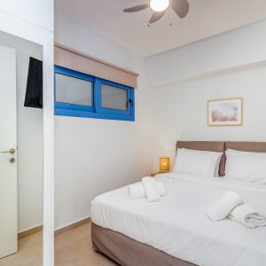 blue-lefkada-luxury-apartments-bedroom-blue-window-copy.jpg
