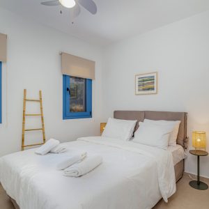 lefkada-blue-luxury-apartments-bed-ladder-fan-copy.jpg