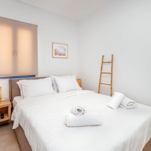 lefkada-blue-luxury-apartments-bedroom-ladder-fan-copy.jpg